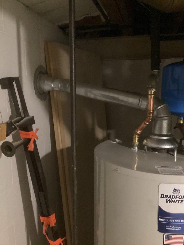 Performed diagnostic inspection on Bradford White tank water heater installed on 12/20/16. Verified proper operation of expansion tank and checked all copper and galvanized pipe connections at the top of the unit. Confirmed system pressure and temperature settings were within manufacturer specifications. No leaks or abnormalities detected in the plumbing configuration.