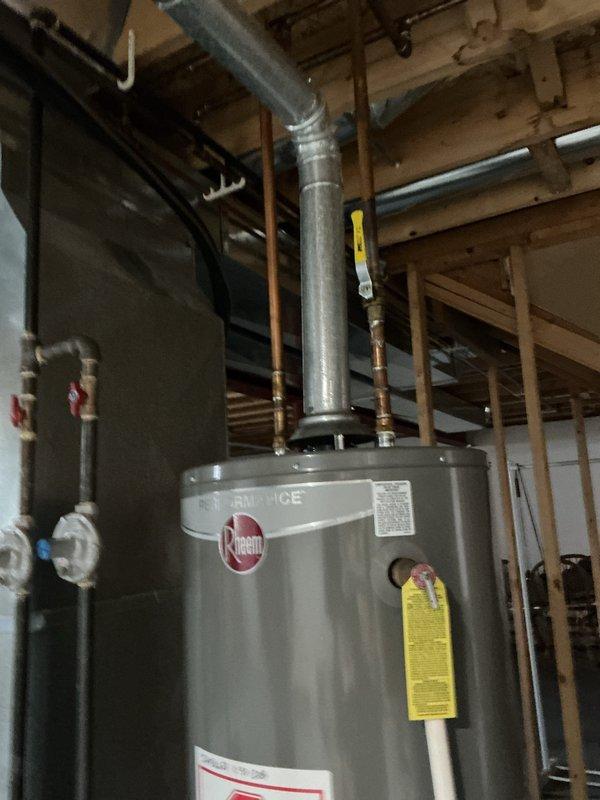Successfully installed new Rheem tanked water heater in residential basement. Completed all necessary copper piping connections, ensured proper ventilation with metal vent pipe, and verified system functionality according to manufacturer specifications.