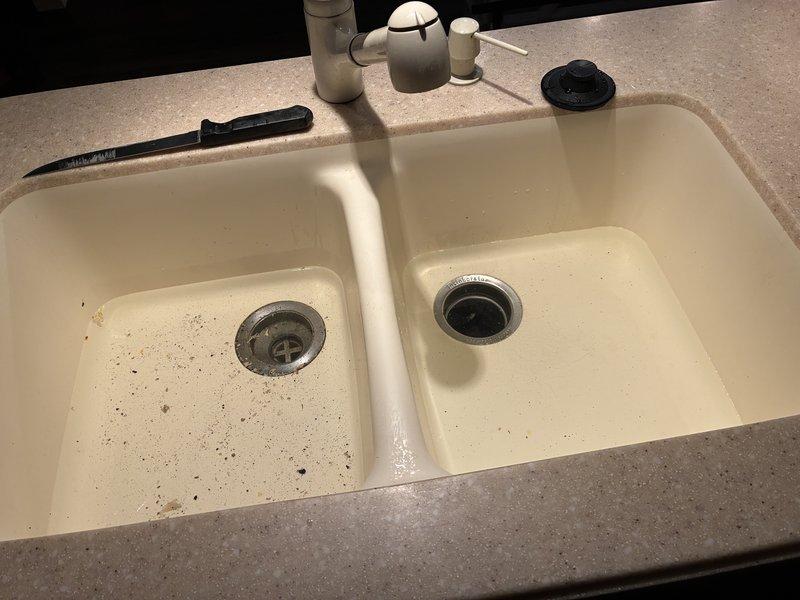 Performed comprehensive kitchen plumbing service addressing debris accumulation in left basin of double-sink system. Conducted thorough inspection and maintenance of existing carbon water filtration system, ensuring proper function of control panel and associated PVC piping connections. Both systems now operating at optimal performance levels.