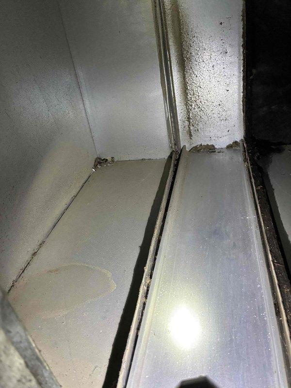 Completed routine tune-up service on customer's HVAC system. Inspected burner assembly and identified ceramic igniter components in good working condition. Found significant mold growth and moisture accumulation in the evaporator section, requiring thorough cleaning and sanitizing to restore proper operation and improve indoor air quality.