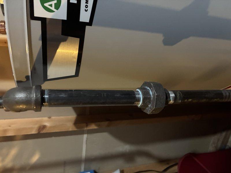 Performed gas line inspection and pressure test on a water heater installation. Located and tightened loose hex union connection on the gas supply pipe, which was causing a leak. Confirmed system integrity with final pressure test showing no further leaks in the gas line.