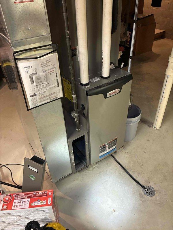 Performed routine maintenance tune-up on residential Lennox HVAC system located in basement utility room. Conducted inspection of PVC venting, electrical components, and drain system. Used hex key to make necessary adjustments to the furnace and air handler system components, ensuring proper operation before completion.