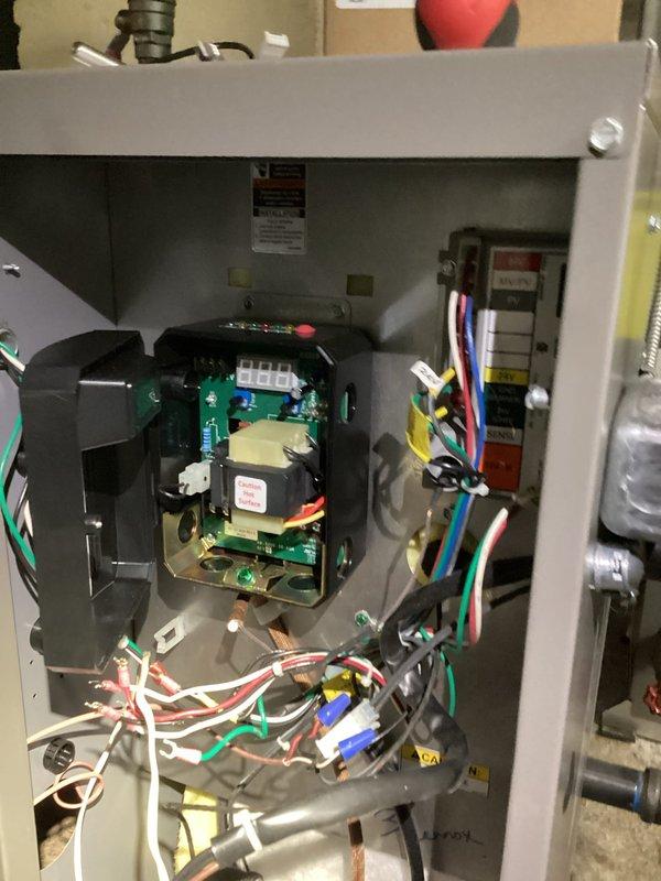 Performed diagnostics on control panel system by examining the circuit board and terminal connections. Inspected wiring integrity and electronic components within the control panel, focusing on the digital display functionality and connection points. Verified proper operation of the control module and secured all electrical connections before completing system testing.
