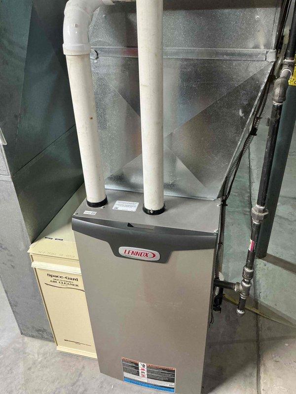 Performed routine maintenance on Lennox HVAC system. Checked system temperature readings with UEi digital meter (85.0°F recorded), and inspected the Space-Gard Air Cleaner. All components functioning within normal parameters; no issues detected.