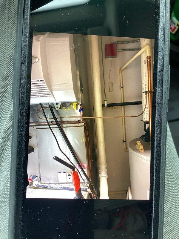 Responded to no heat complaint on 10+ year old system. Diagnostic inspection revealed failed ignitor and clogged condensate drain line causing system shutdown. Replaced ignitor, cleared drainage system, and cleaned blower assembly to restore proper operation. System now functioning within normal parameters.