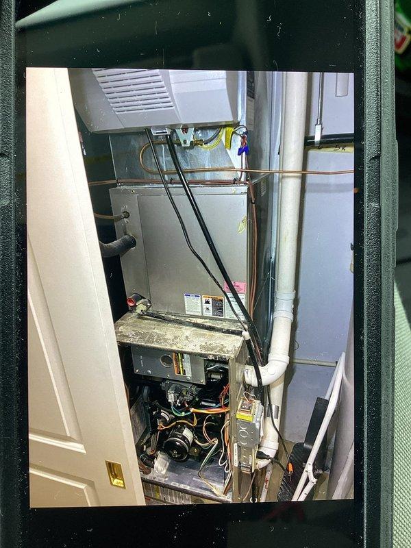 Responded to no heat complaint on 10+ year old system. Diagnostic inspection revealed failed ignitor and clogged condensate drain line causing system shutdown. Replaced ignitor, cleared drainage system, and cleaned blower assembly to restore proper operation. System now functioning within normal parameters.