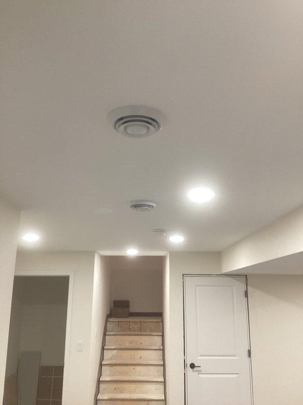 Completed warranty inspection of recently installed HVAC system. Verified proper installation of ceiling vents with appropriate air distribution in main living area. Confirmed correct placement and functionality of wall-mounted return air register in compliance with manufacturer specifications.