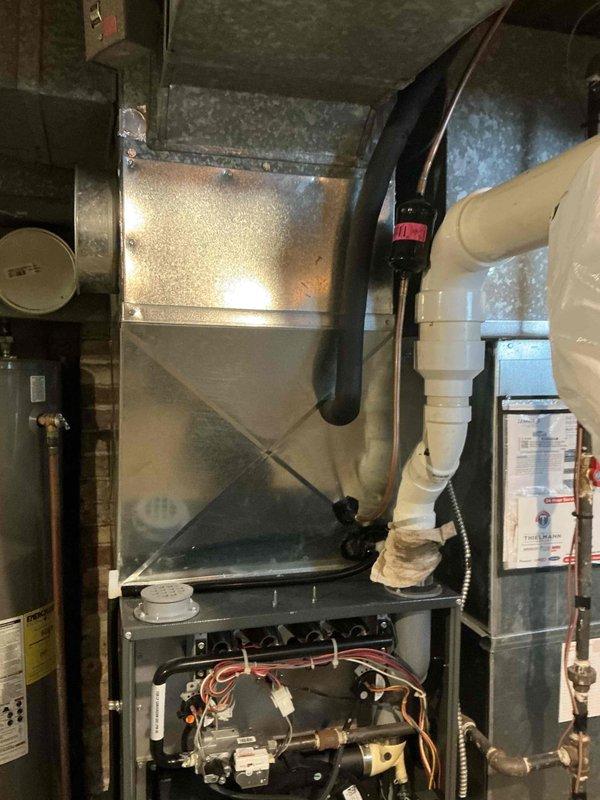 Conducted comprehensive HVAC system replacement in utility room, installing new air handler unit with proper sheet metal ductwork connections. Completed installation of condensate drain system using PVC piping with appropriate connections and verified proper functioning of all electrical components including control board and wiring harnesses.