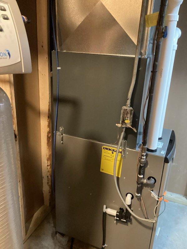 Successfully installed a new high-efficiency furnace in the utility room with properly connected PVC venting system. Ensured all connections to existing mechanical systems were properly secured, including gas line and electrical components. Unit was tested for proper operation with the EnergyGuide label affixed to confirm efficiency ratings.