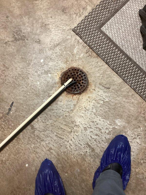 Performed inspection and maintenance of HVAC ductwork system, focusing on proper connection and sealing of metal ducts including 90-degree elbow joints. Also cleaned and cleared floor drain using specialized snake tool to ensure proper drainage and prevent potential water backup issues that could affect indoor air quality.