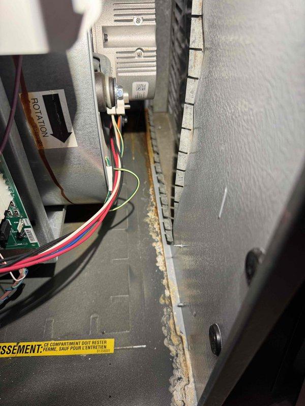 Performed routine tune-up service on HVAC system. Observed significant dust accumulation in ventilation compartment requiring thorough cleaning. Identified and documented severe rust/corrosion on copper pipe connections near blower assembly that will require replacement to prevent potential system failure.