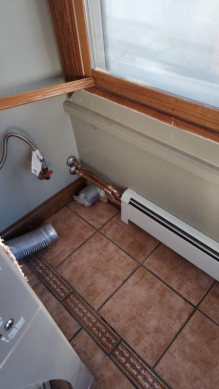 Successfully installed new baseboard heating units in the residence. Units were properly mounted along walls beneath windows with connection to existing copper piping system. Installation included connecting all necessary valves and pressure components, ensuring proper operation of the complete heating system.