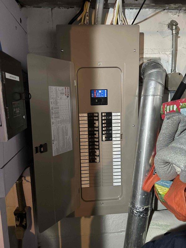 Conducted a thorough assessment of the existing electrical panel and HVAC system for mini-split installation feasibility. Documented the panel's capacity and current breaker configuration to determine appropriate electrical requirements for the proposed mini-split system. Evaluated basement utility area for optimal condensate line routing and potential mounting locations for indoor air handler and outdoor condenser unit.