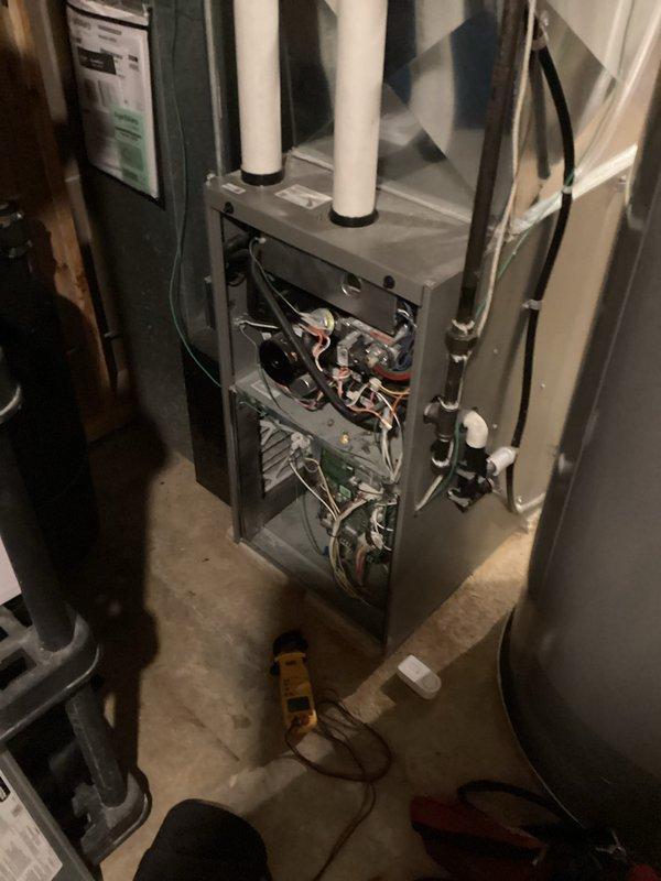 Performed diagnostic assessment on Goodman furnace exhibiting no-heat condition. Removed access panel to inspect internal components and utilized multimeter to test electrical connections. Identified faulty control board as the source of system failure, as evidenced by irregular voltage readings at the circuit board terminals. Replaced defective control board and verified proper system operation with complete heating cycle test.