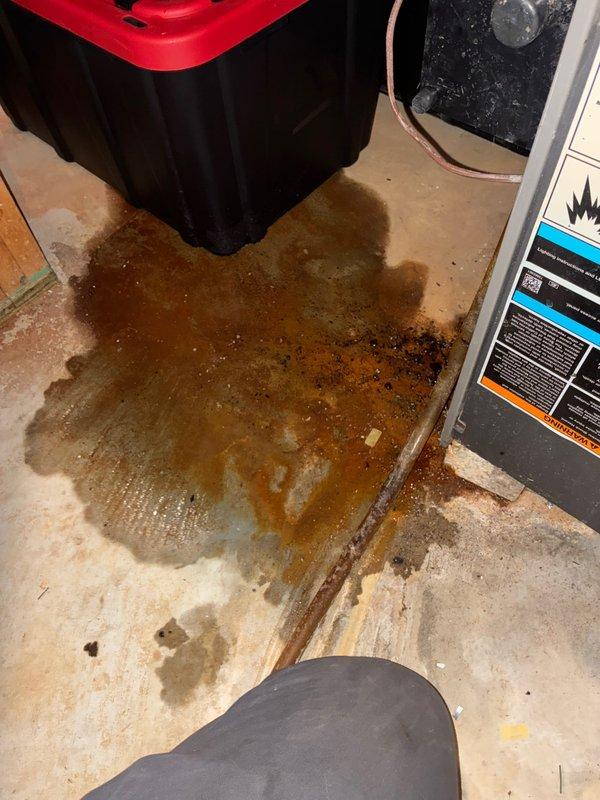 Responded to no heat call for 10+ year old furnace system. Upon inspection, found significant water leak from failed condensate drain causing water accumulation on basement floor. Removed front panel to examine internal components and discovered the blower motor was not operating due to water damage. Installed new motor assembly, cleaned water damage, and restored proper drainage pathway. System tested operational with normal heat output following repair.