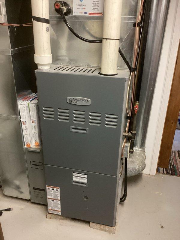 Completed routine maintenance on Armstrong Air furnace system. Inspected PVC intake and exhaust venting components, checked connections to ductwork, and confirmed proper installation of the unit. All systems operating within normal parameters with no issues detected.