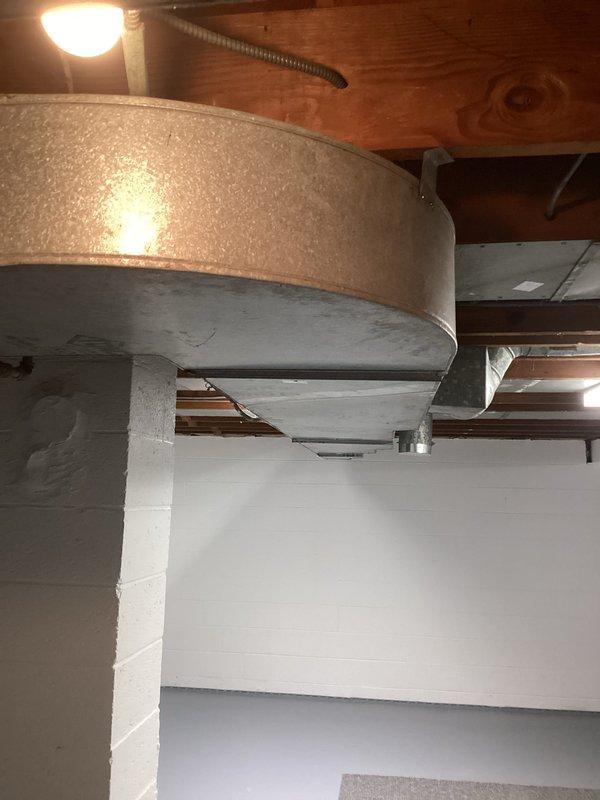 Performed routine maintenance and inspection on basement-installed furnace system. Opened access panel to examine internal components including motor, control elements, and wiring. Checked/replaced blue air filter and inspected all ductwork connections in unfinished basement for proper installation and airflow efficiency.