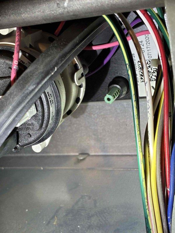 Performed routine tune-up of HVAC system, inspecting electrical connections and wiring integrity. Identified significant corrosion on copper lines and valve assembly requiring attention. Documented condition of internal components and recommended preventative maintenance to address oxidation before it affects system performance.