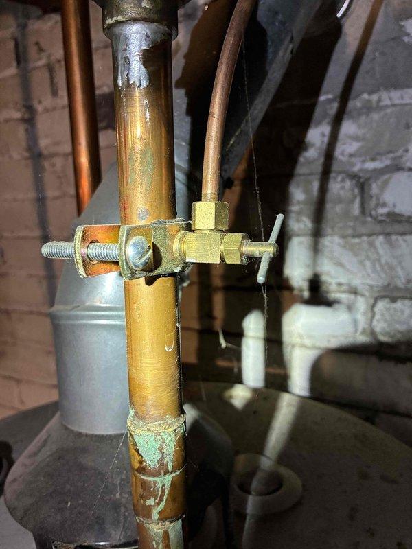 Performed routine tune-up of HVAC system, inspecting electrical connections and wiring integrity. Identified significant corrosion on copper lines and valve assembly requiring attention. Documented condition of internal components and recommended preventative maintenance to address oxidation before it affects system performance.