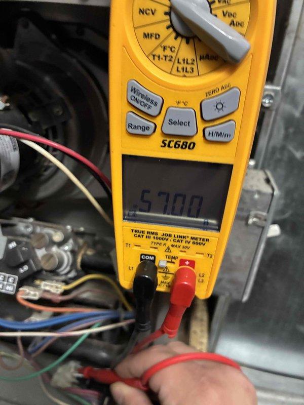 Performed comprehensive HVAC system tune-up including inspection and replacement of 16x25x1 air filter. Conducted electrical diagnostic testing with SC680 multimeter, measuring voltage readings of 5700 across system components and verifying proper electrical connections to ensure optimal equipment operation and efficiency.