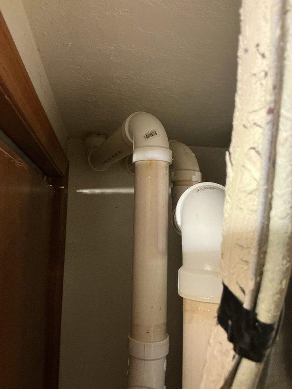 Performed detailed inspection of existing furnace system with exposed internal components including control boards, blower motor, and electrical connections. Evaluated PVC exhaust/intake venting and adjacent plumbing installation. Prepared comprehensive replacement estimate for aging HVAC equipment to improve system reliability and efficiency.