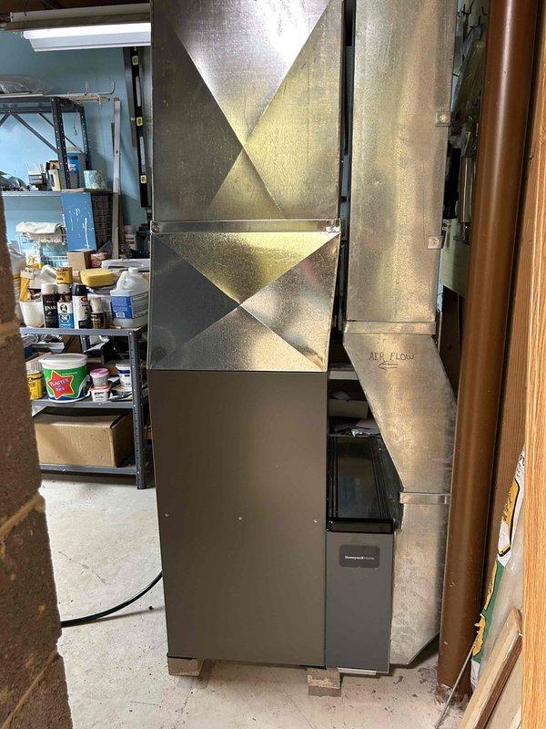 Successfully installed a high-efficiency furnace with proper ductwork connections in the client's utility room. Completed all necessary plumbing and electrical connections, ensuring proper insulation of black piping and secure mounting of junction box. System was tested and is functioning optimally with appropriate airflow.