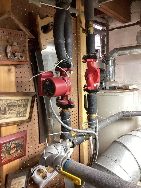 Diagnosed and serviced a 10+ year old heating system exhibiting no-heat condition. Identified faulty circulation pumps on the hydronic heating system and replaced both red pumps with new units, ensuring proper electrical connections and testing system functionality. System now operating at optimal performance with restored heat output.