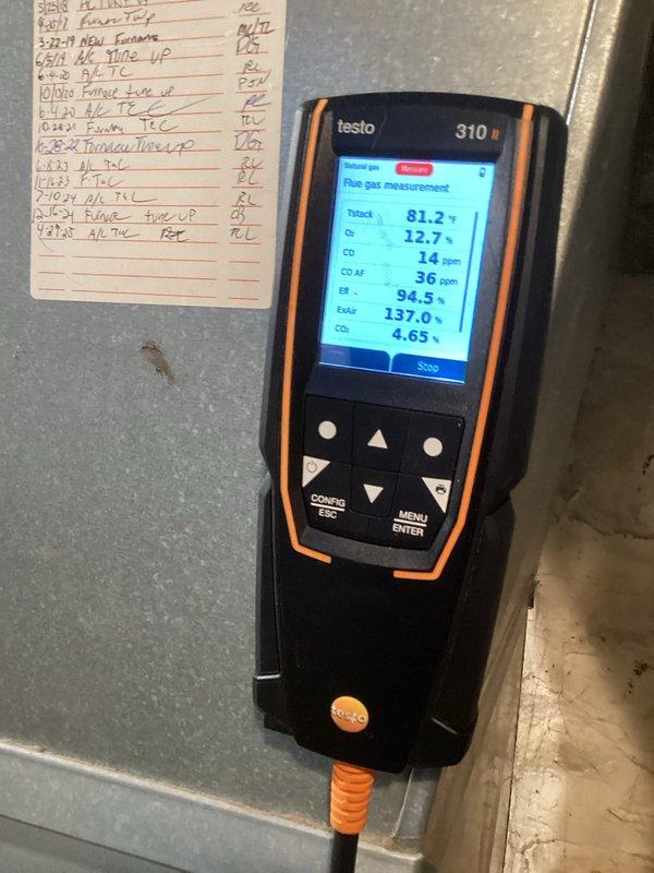 Performed comprehensive tune-up on gas furnace system. Conducted combustion analysis with Testo 310 analyzer showing excellent efficiency rating of 94.5% with acceptable CO levels (14ppm). Inspected internal components including control board, motor, and wiring connections. All systems operating within manufacturer specifications after service.
