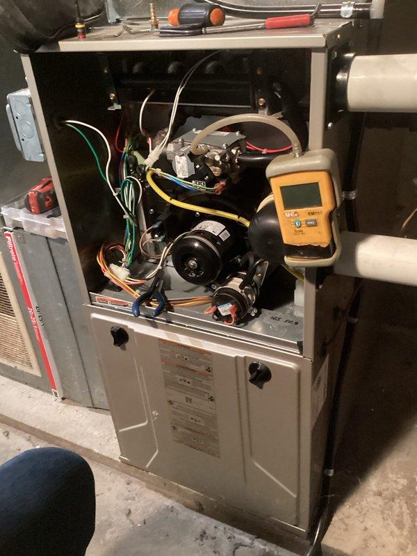 Performed comprehensive tune-up on gas furnace system. Conducted combustion analysis with Testo 310 analyzer showing excellent efficiency rating of 94.5% with acceptable CO levels (14ppm). Inspected internal components including control board, motor, and wiring connections. All systems operating within manufacturer specifications after service.