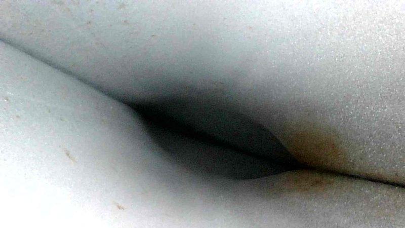 Performed comprehensive tune-up inspection on HVAC system. Identified mold growth in condensate drain line and significant deterioration of duct insulation. Cleaned drain line, applied antimicrobial treatment, and documented insulation condition for future replacement recommendation.