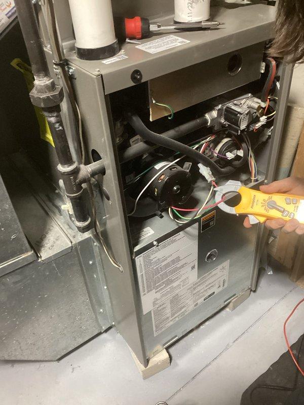 Performed comprehensive tune-up service on residential HVAC furnace unit. Opened access panel to conduct full diagnostic testing with multimeter on electrical components and inspected blower motor functionality. Checked PVC venting system and all connections for proper operation and sealed any potential leak points.