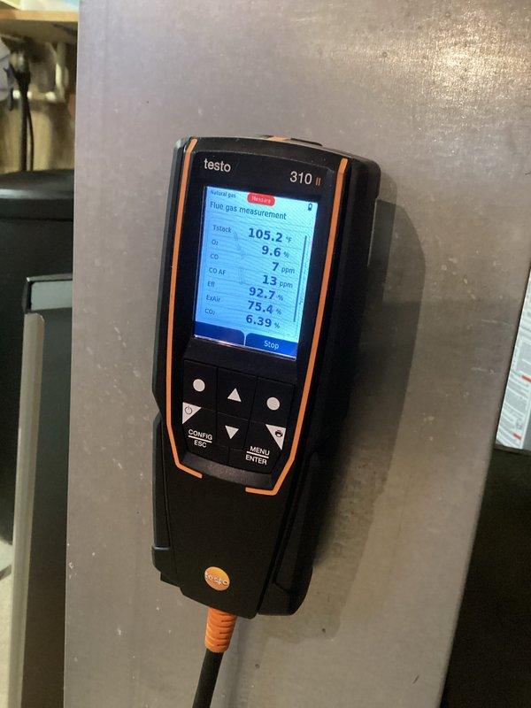 Performed comprehensive HVAC tune-up including inspection of internal components and electrical connections. Conducted full combustion analysis using Testo 310 II analyzer, which revealed proper combustion efficiency at 92.7% with CO2 at 6.39% and minimal CO levels (7 ppm). System is operating within manufacturer specifications with all safety controls functioning correctly.