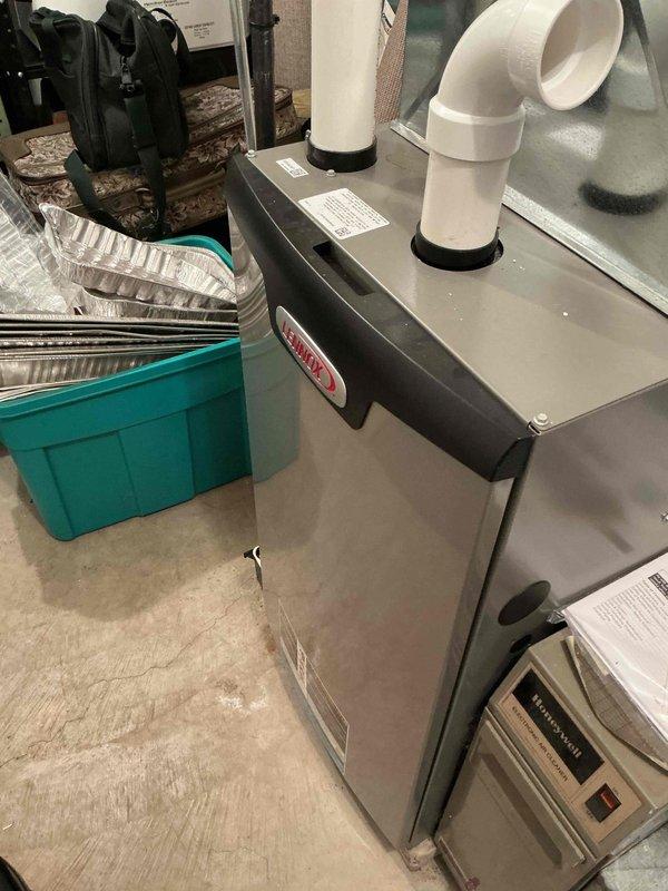 Performed comprehensive tune-up on Lennox HVAC system. Conducted temperature differential testing using UEi digital probe (reading 22.6°), verified proper venting through PVC exhaust connections, and inspected all system components. System is functioning within normal parameters with no operational issues detected.