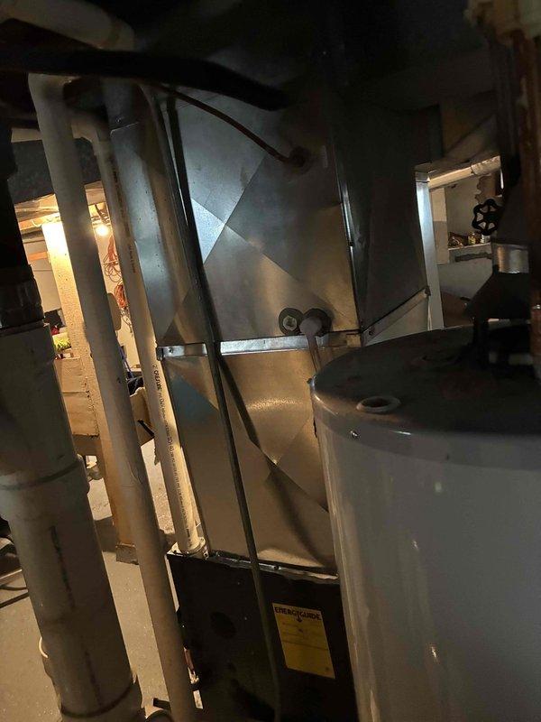 Performed annual maintenance on furnace including heat exchanger inspection and flame sensor cleaning. Unit operating within normal parameters after service. Documented baseline operation for future reference with photographic evidence of equipment condition and internal components.