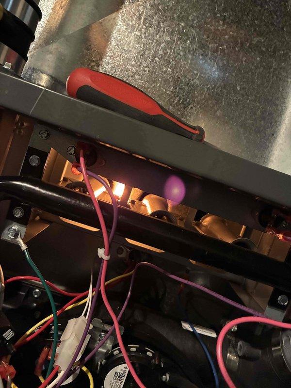 Performed annual maintenance on furnace including heat exchanger inspection and flame sensor cleaning. Unit operating within normal parameters after service. Documented baseline operation for future reference with photographic evidence of equipment condition and internal components.