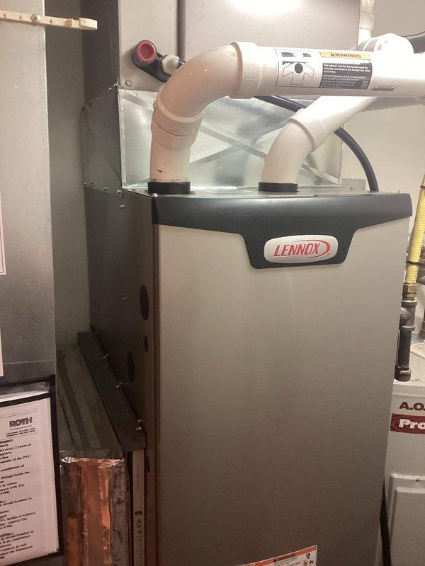 Successfully installed a new Lennox furnace in the utility room, complete with proper PVC ventilation system featuring intake and exhaust pipes. Connected the unit to the existing ductwork with appropriate transitions and ensured all electrical connections and condensate drainage were properly configured for optimal performance.