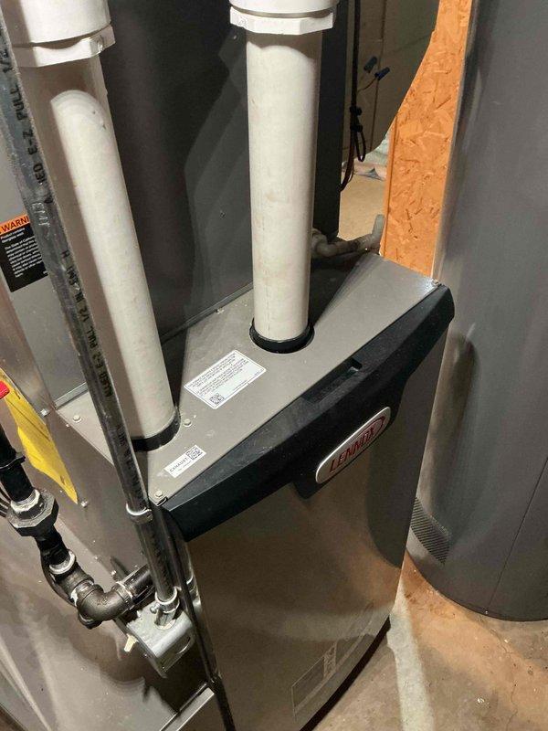 Performed annual tune-up on Lennox furnace system. Inspected unit, verified proper installation of exhaust/intake PVC venting, and checked all connection points. Temperature testing showed supply air at 118.1F, which falls within normal operating parameters. System appears to be in good working condition with no visible damage or anomalies.