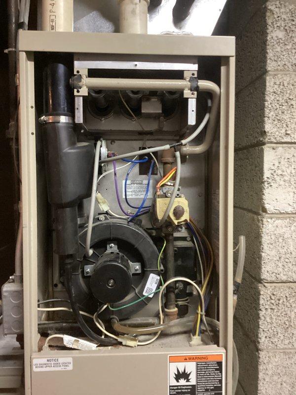 Removed and replaced severely corroded blower motor mounting bracket that exhibited significant rust damage. Inspected and tested the furnace system after installation, confirming proper operation of the blower motor assembly and verifying all electrical connections were secure and functioning correctly.