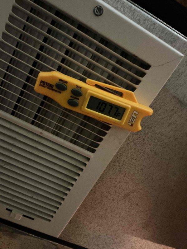 Performed routine HVAC maintenance inspection, identifying significant condensation buildup within the ductwork. Conducted temperature readings at supply vents using an SDT660 measuring device, which recorded 107°F output temperature. Detected early signs of rust/corrosion developing on interior duct surfaces, likely resulting from excessive moisture accumulation.