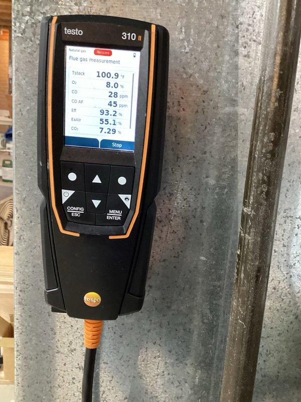 Performed comprehensive tune-up on heating system including electrical connection inspection and combustion analysis. Testo 310 analyzer readings confirmed optimal system operation with 93.2% efficiency, acceptable CO levels (28 ppm), and proper oxygen/CO2 balance. All electrical connections were examined and verified to be secure with no signs of damage or overheating.