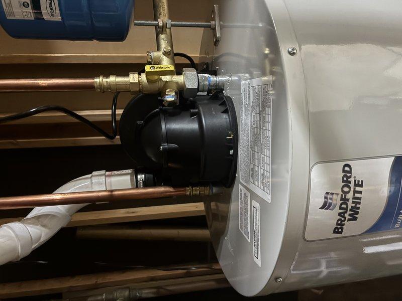 Completed installation of Bradford White water heater system in residential utility room. Installed new copper supply lines with brass valve assembly and ensured proper connection to existing plumbing. All connections were secured and tested for proper operation prior to completion.