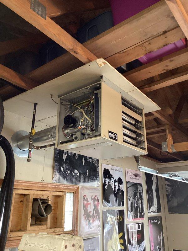 Performed diagnostic inspection on ceiling-mounted Lennox HVAC unit in basement showing no heat operation. Unit appears to be 10+ years old with deteriorated components. Replaced faulty ignition assembly and cleaned flame sensor to restore proper heating function. System now operating within normal parameters with good heat output and proper cycling.