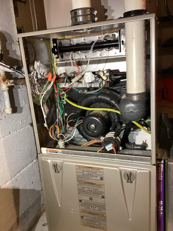 Completed comprehensive annual tune-up on customer's furnace system, inspecting all internal components. Removed front panel to access and clean blower assembly, check electrical connections, and verify proper operation of motor. Examined circuit boards and control wiring for any signs of wear or damage - all components functioning normally. System returned to service in good operating condition.