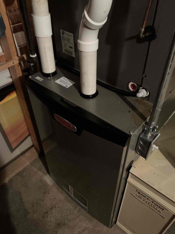 Performed routine tune-up on Lennox furnace system located in basement. Used UEi diagnostic tool to verify proper temperature readings and system functionality. Inspected PVC venting pipes and connections for integrity and proper installation. System operating within normal parameters after service.
