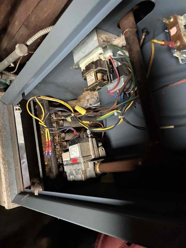 Responded to no-heat complaint on aging HVAC system (10+ years). Upon inspection, found dust buildup in utility space affecting system performance. Cleaned critical components including gas valve assembly and electrical connections, ensuring proper operation of the furnace. System now functioning correctly with normal heat output.