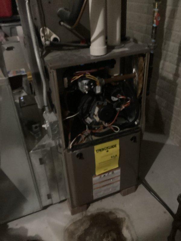 Performed comprehensive tune-up service on residential gas furnace installed in basement. Conducted thorough inspection of all internal components including control board, wiring connections, and exhaust system. Checked PVC venting pipes for proper installation and potential obstructions. Noted possible previous water leak near unit base; recommended monitoring for recurrence. All systems tested operational with no immediate concerns identified.