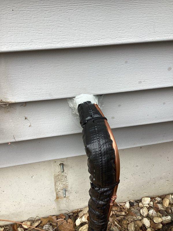 Successfully completed installation of a complete HVAC system, including proper mounting of the outdoor condenser unit on a concrete pad with appropriate clearance and drainage area. Installed and insulated refrigerant lines with professional penetration through exterior siding, ensuring proper sealing with caulking to prevent air leakage and maintain system efficiency.