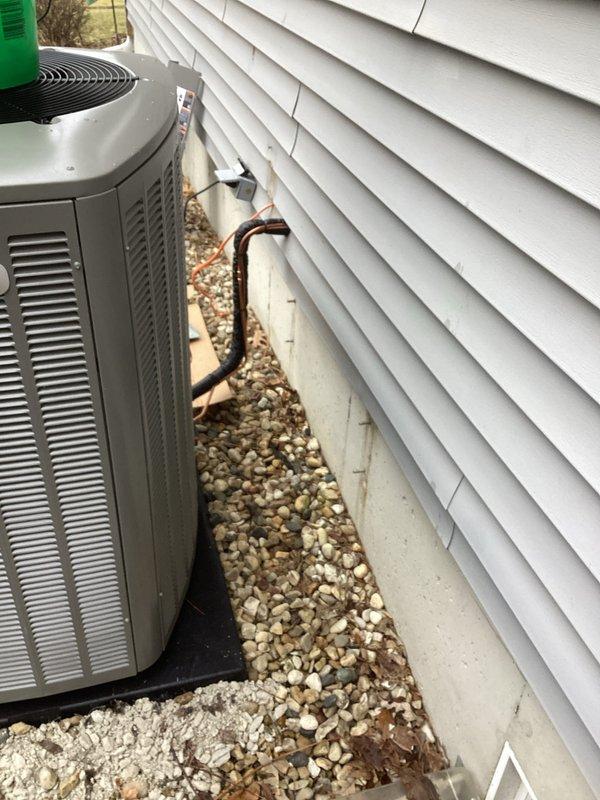 Successfully completed installation of a complete HVAC system, including proper mounting of the outdoor condenser unit on a concrete pad with appropriate clearance and drainage area. Installed and insulated refrigerant lines with professional penetration through exterior siding, ensuring proper sealing with caulking to prevent air leakage and maintain system efficiency.