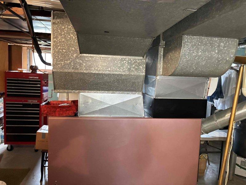 Completed tune-up service on HVAC system with focus on the Aprilaire humidifier unit mounted on ductwork. Inspected and cleaned humidifier components, checked water panel for mineral buildup, verified proper drainage and water supply. Examined adjacent ductwork insulation integrity and connections, ensuring proper airflow throughout the system.