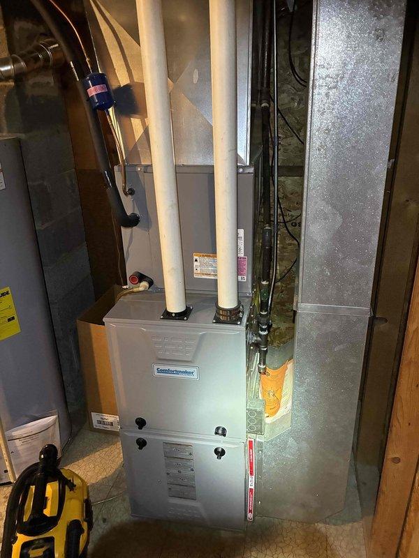 Performed routine HVAC tune-up on Comfortmaker system, discovering and replacing corroded drain component that showed significant oxidation. Inspected ductwork, PVC ventilation pipes, and electrical connections, confirming proper system operation after service.